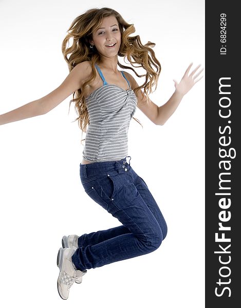 Happy jumping young girl on  an isolated white background