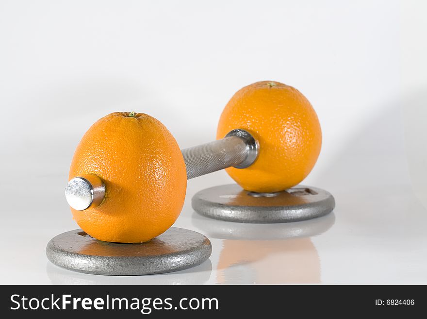 Two oranges on a dumbel. Two oranges on a dumbel