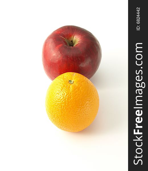 Orange and apple on white isolated background. Orange and apple on white isolated background.