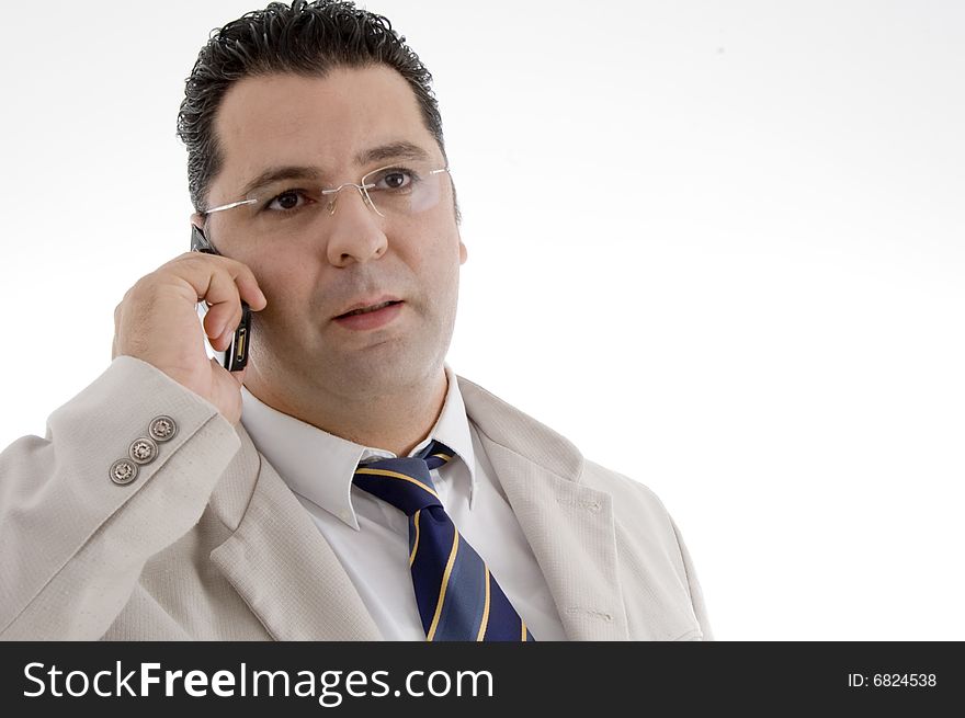 Portrait of businessman talking on cell phone on  an isolated white background