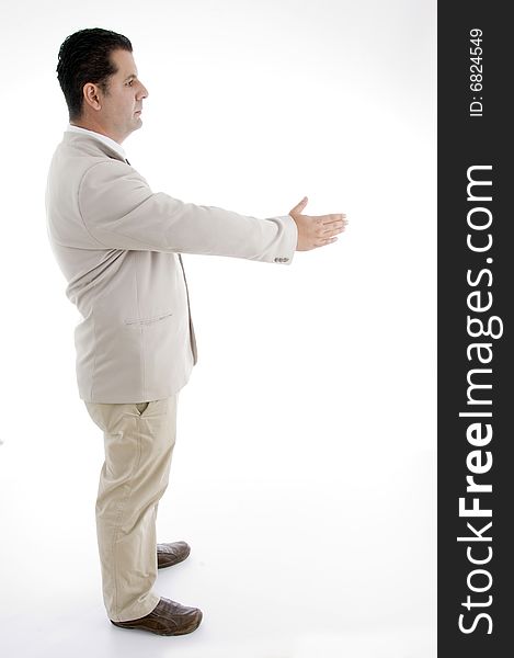 Side view of businessman offering hand shake on an isolated white background