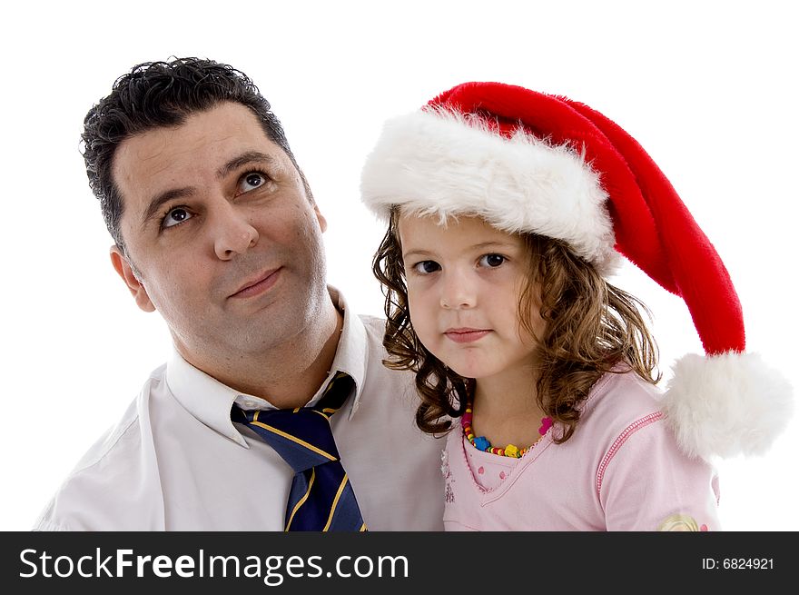 Little girl wearing christmas hat posing with her father