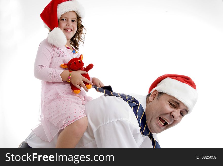 A smiling little girl sitting on her father's back