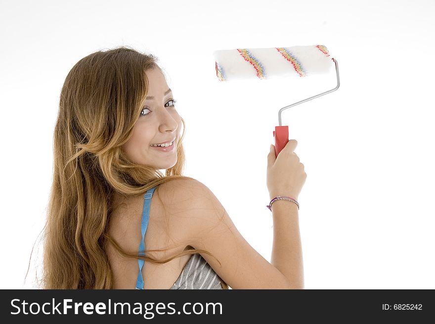 Teenager painting with roller brush on  an isolated white background