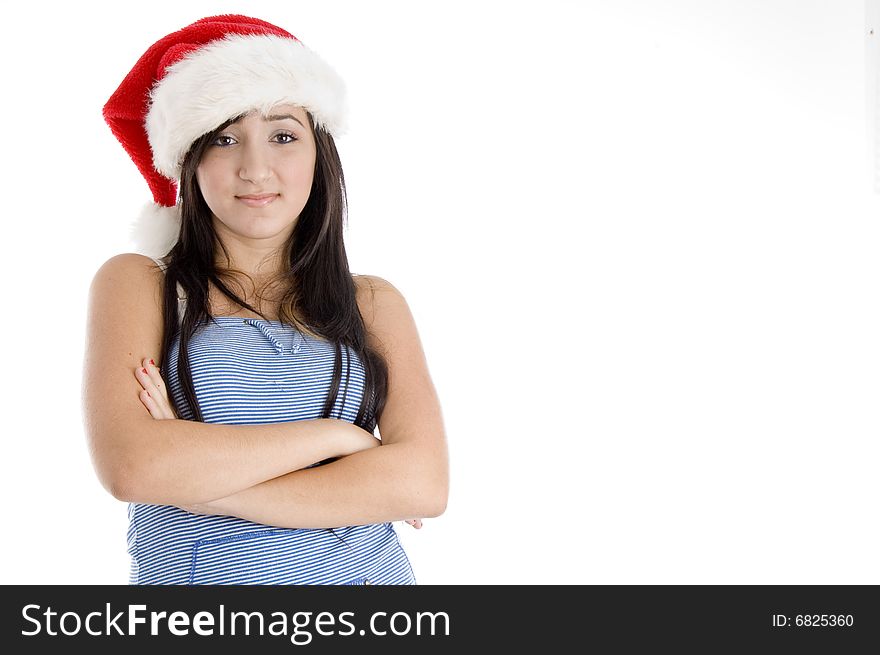 Girl with christmas hat looking at camera on  an isolated white background