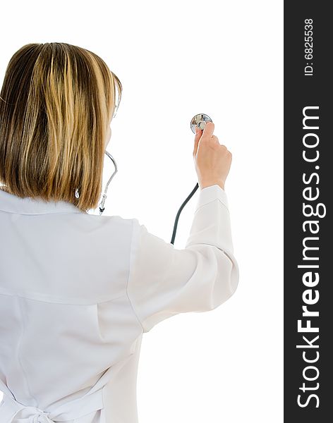 Young woman doctor examines with stethoscope on white. Young woman doctor examines with stethoscope on white