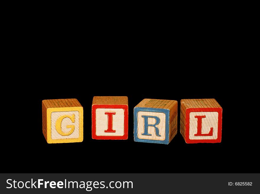 Four wooden baby blocks spell the word Girl with room for copy. Four wooden baby blocks spell the word Girl with room for copy.