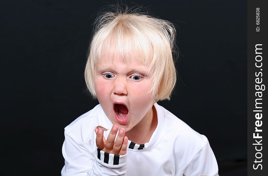 Beautiful little girl with a funny expression on her face. Beautiful little girl with a funny expression on her face