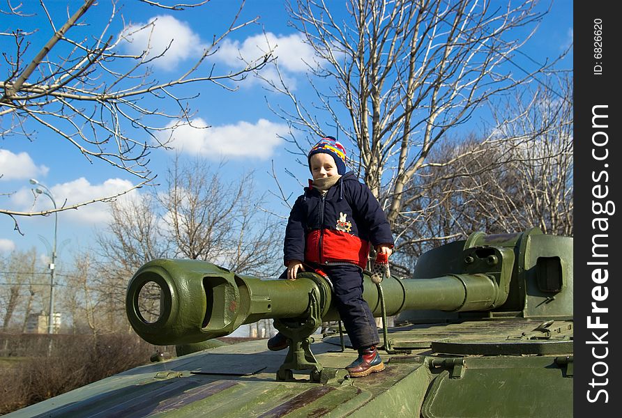 The Boy Sitting On The Tank