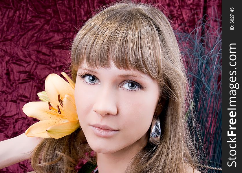 Beautiful angelic woman with a yellow flower. Beautiful angelic woman with a yellow flower