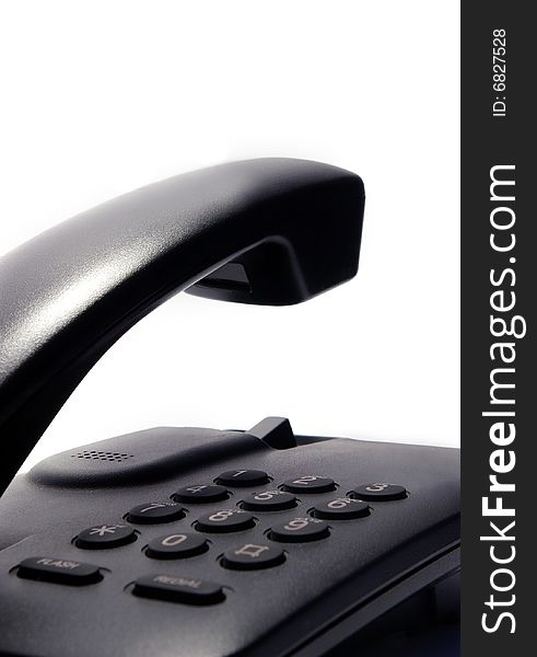 Black telephone isolated on a white background. Black telephone isolated on a white background