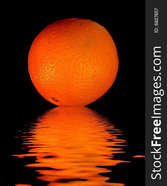 Colored orange -  on black with reflection in water