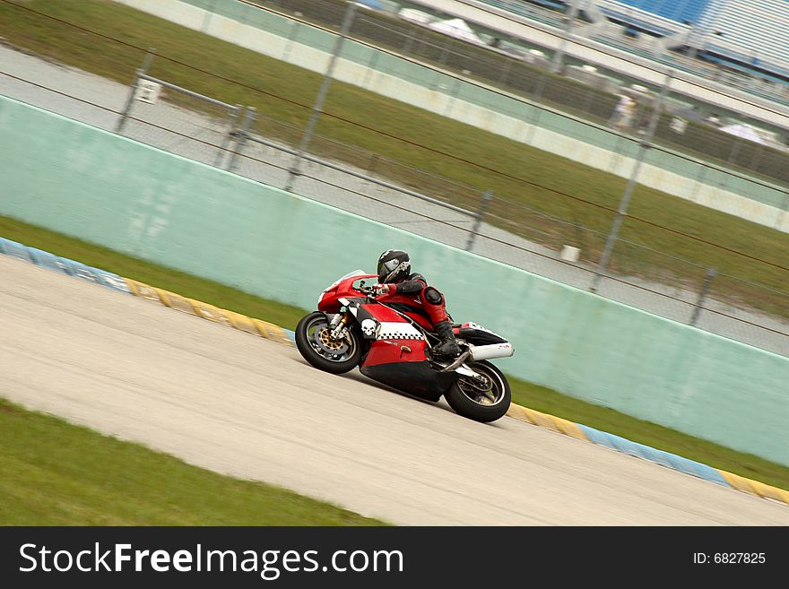 Red and white Motorcycle on a curve. Red and white Motorcycle on a curve