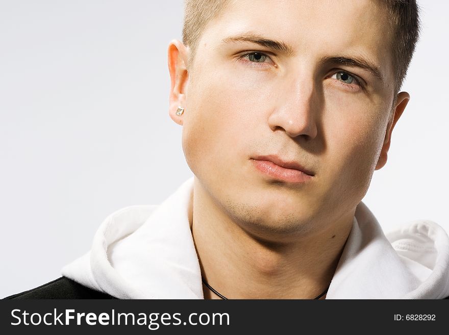 Attractive modern man in white and black clothes