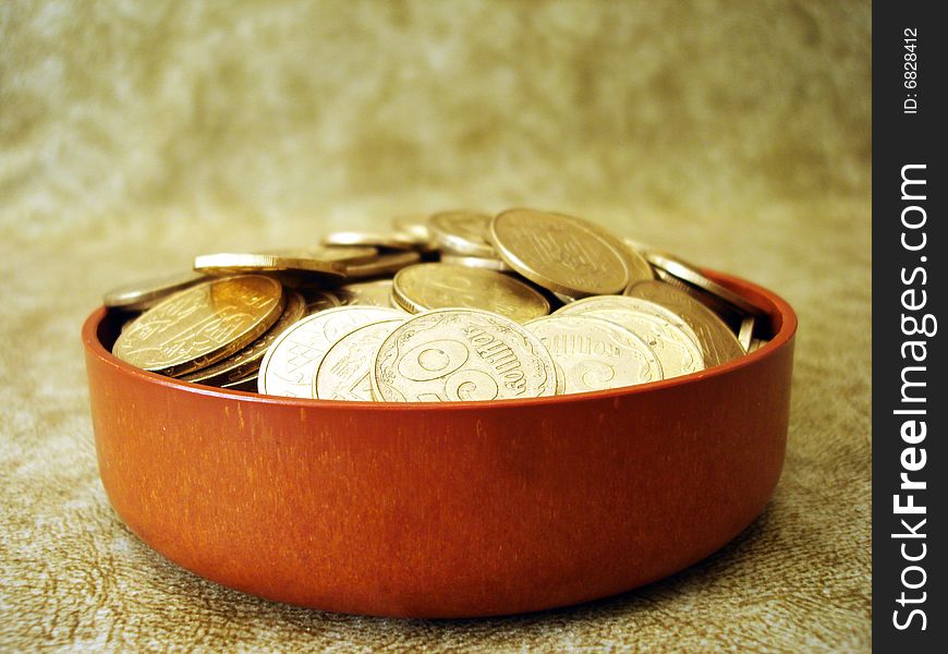 Golden coins in a small box. Golden coins in a small box