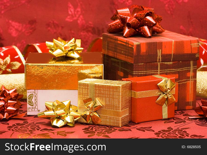 Red and golden gift boxes with bow