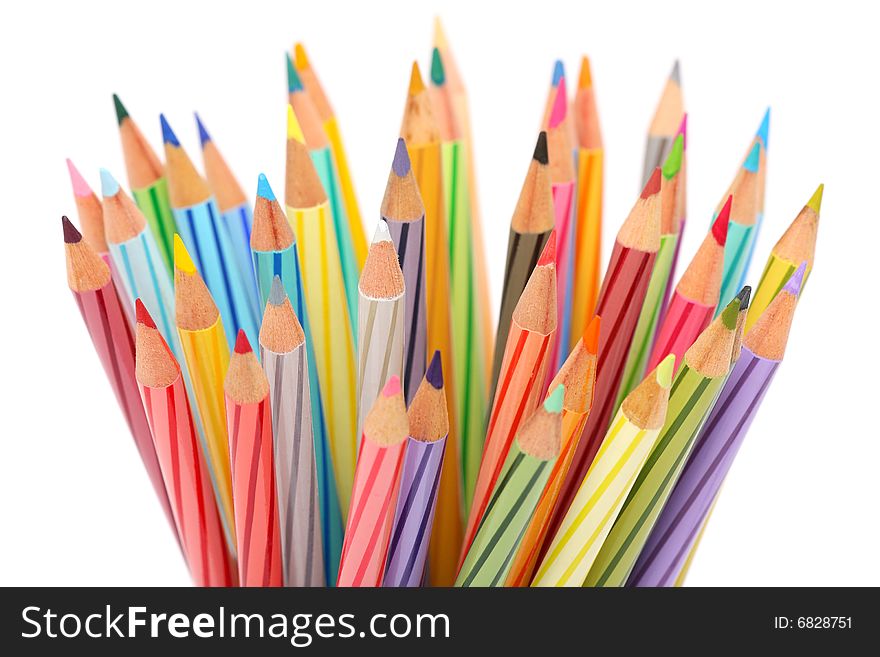 Close up of colorful color pencils over white background.