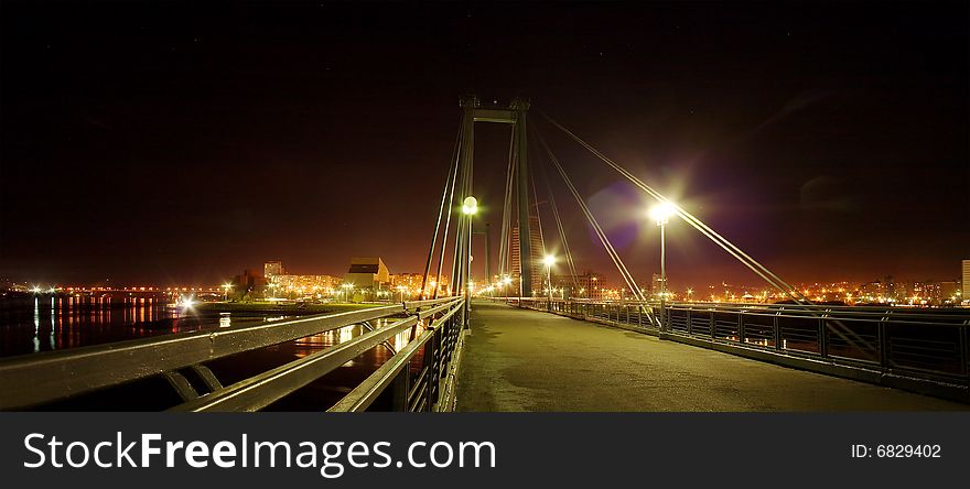 Pendant bridge in Krasnoyarsk at night. Russia, Siberia, Krasnoyarsk. Pendant bridge in Krasnoyarsk at night. Russia, Siberia, Krasnoyarsk