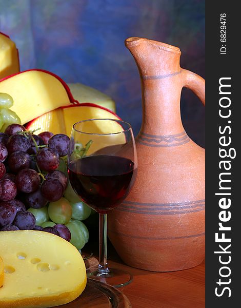 Still-life with cheese, grape and wine. Still-life with cheese, grape and wine.