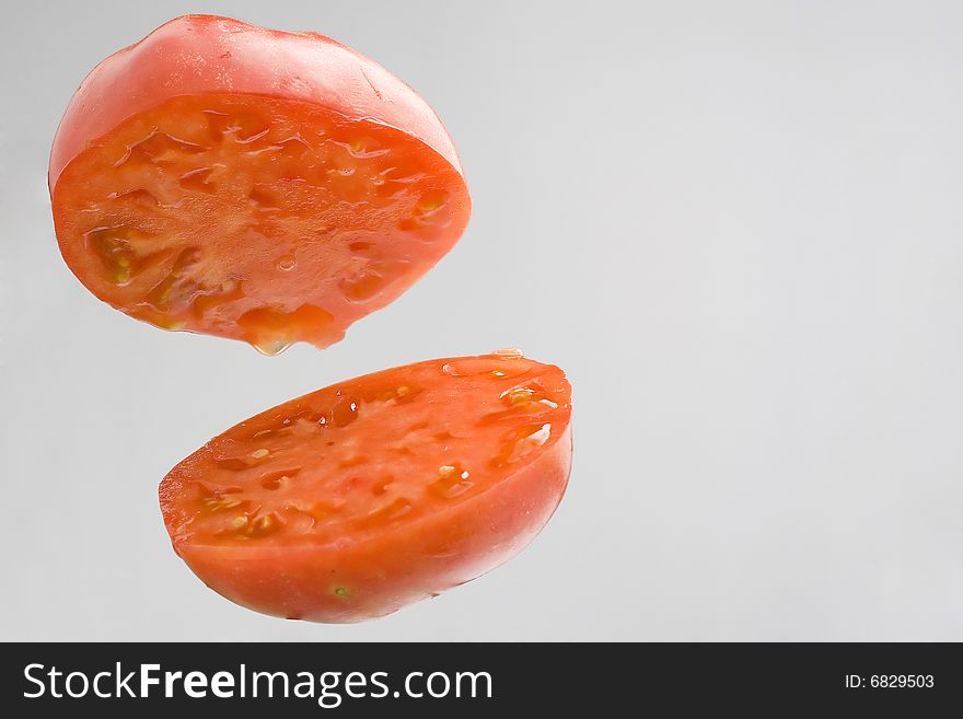Fresh tomatoes naturally divided into two parts