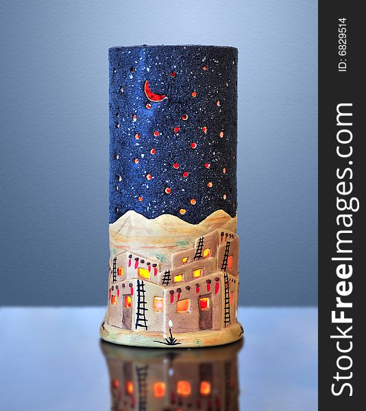 Decorative christmas candlestick on the blue background