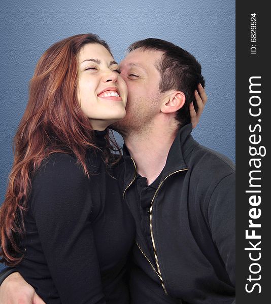 Young couple kissing, and having fun