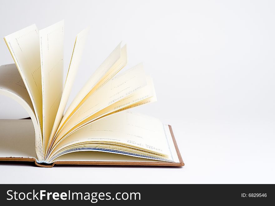 Open book with white sheets isolated over white