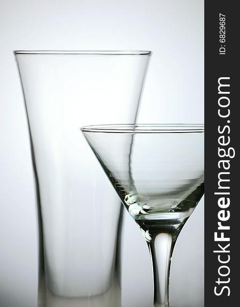 Transparent wine glass on light grey background