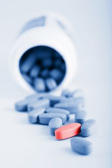 Blue Prescription Pills With One Red Pill Stock Images