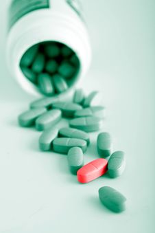 Green Prescription Pills With One Red Pill Royalty Free Stock Photo