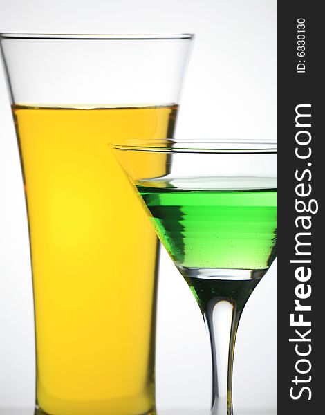 One Glass Juice and Martini on Whiter Background