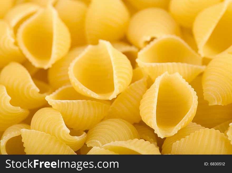 Yellow raw pasta. abstract background. Yellow raw pasta. abstract background
