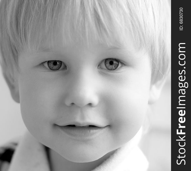 Black and white portrait of child with blond hair