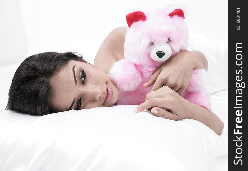 Woman In Bed With Teddy Bear