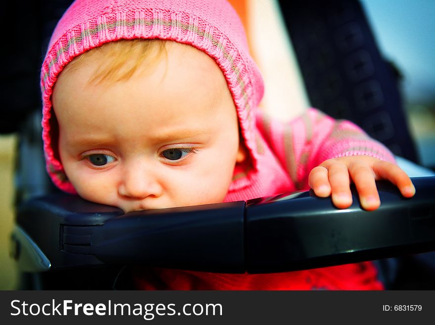 Serious Baby Of 6 Months In The Stroller