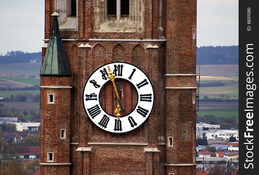 The clock of an old church in Bavaria (Landshut). The clock of an old church in Bavaria (Landshut)