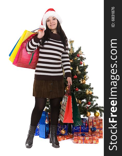 Attractive brunette woman happy over christmas tree. Attractive brunette woman happy over christmas tree