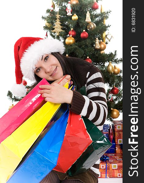 Attractive brunette woman happy over christmas tree. Attractive brunette woman happy over christmas tree