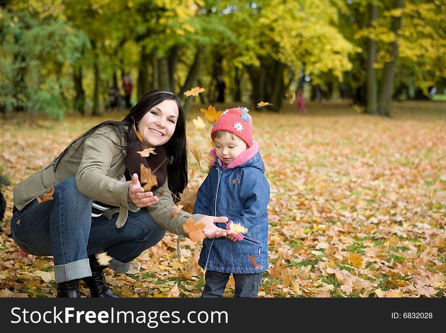 Mother and daughter playing in park. Mother and daughter playing in park