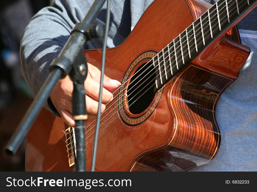 Man Playing A Acoustic Guitar