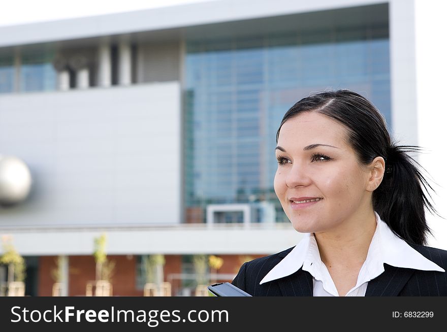 Attractive, successful brunette businesswoman outdoor