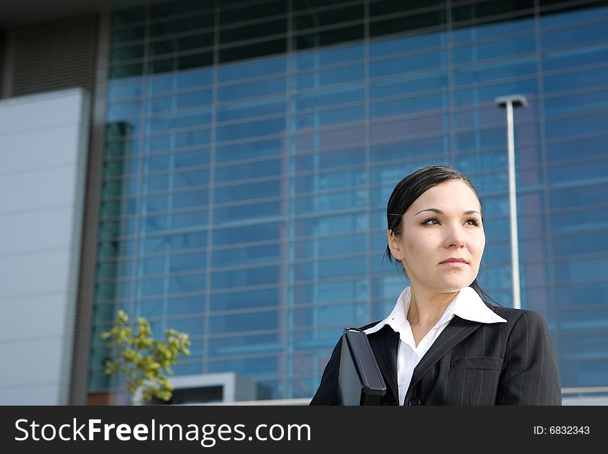 Attractive, successful brunette businesswoman outdoor