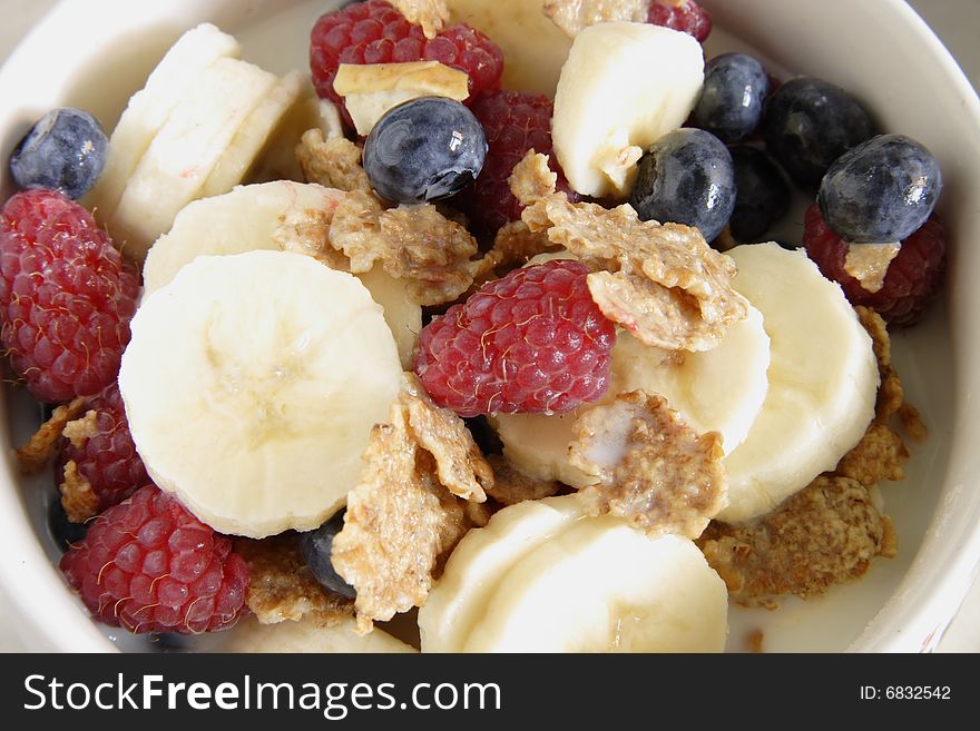 Bowl of cereal with lots of  fresh fruit. Bowl of cereal with lots of  fresh fruit