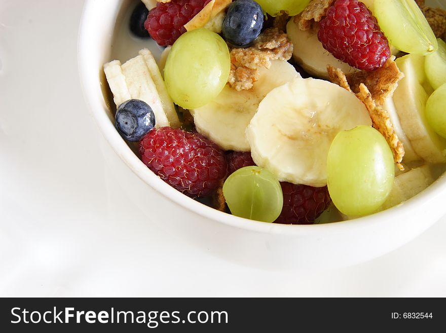 Bowl of cereal with lots of fresh fruit. Bowl of cereal with lots of fresh fruit