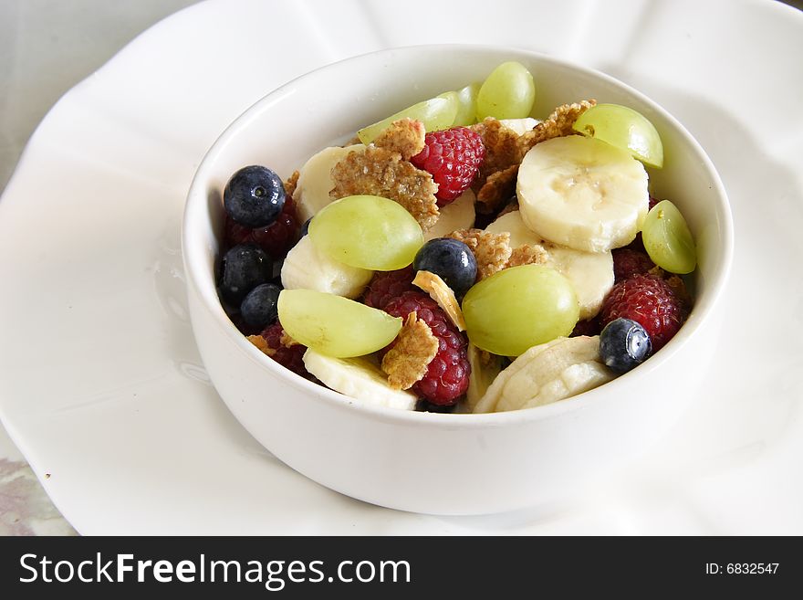 Bowl of cereal with lots of  fresh fruit. Bowl of cereal with lots of  fresh fruit