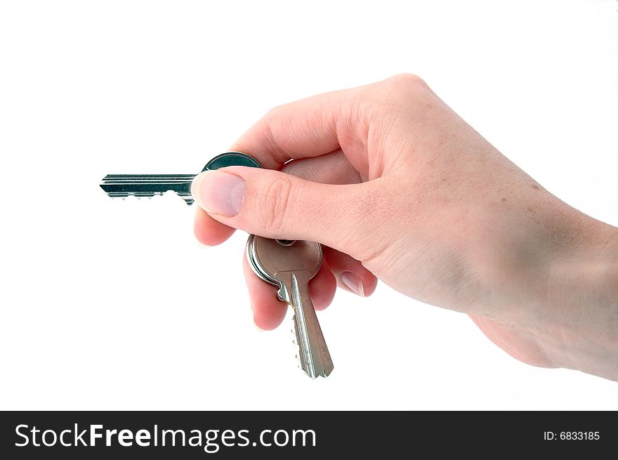 An isolated image of a hand holding keys ready to open a lock. An isolated image of a hand holding keys ready to open a lock