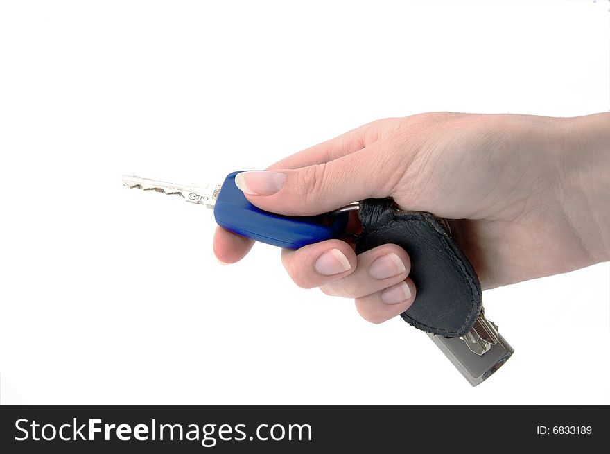 An isolated image of a hand pressing a button on a vehicle key fob. An isolated image of a hand pressing a button on a vehicle key fob