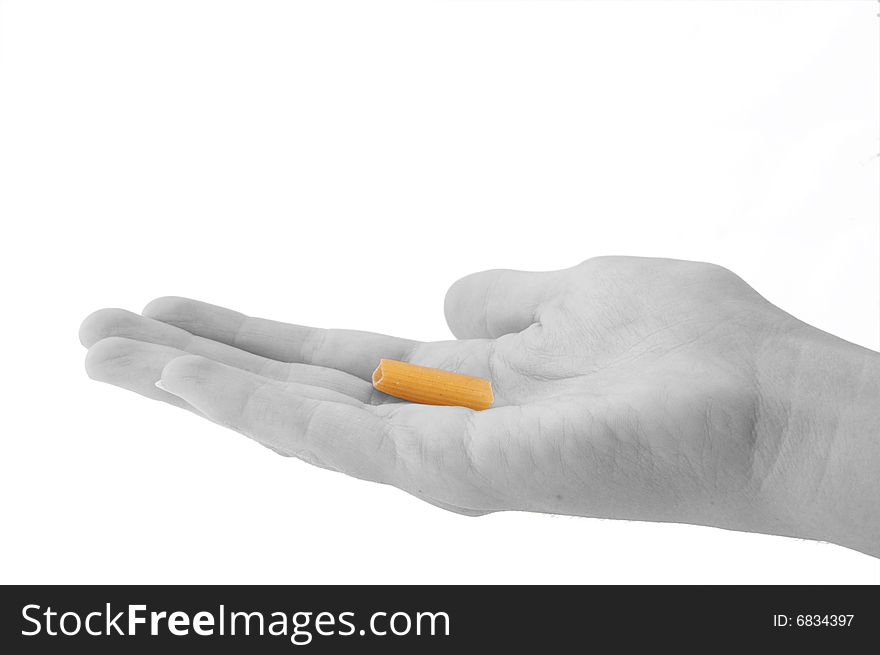 An isolated image of a black and white hand holding a single piece of penne pasta. An isolated image of a black and white hand holding a single piece of penne pasta