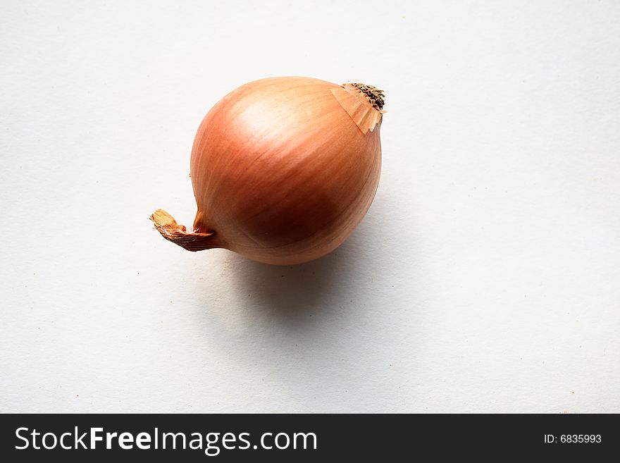Raw onion shot against a white background