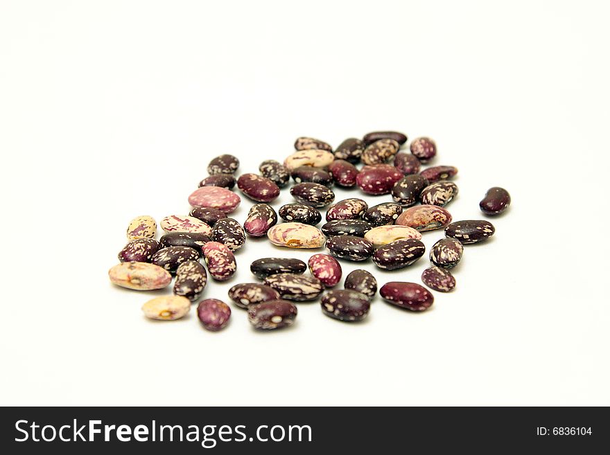 A handful of beans on a white background